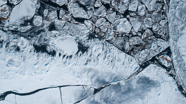 drone view: ice floes on the river in winter
