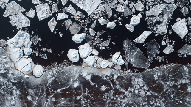 drone view: ice floes on the river in winter