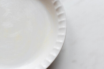 empty buttered quiche or pie dish 