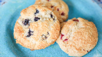 Assorted berry scones on blue plate