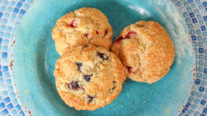 Assorted berry scones on blue plate