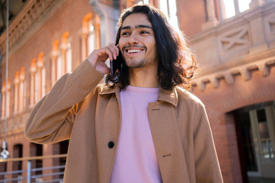 Elegant Young Man Talking On The Phone.