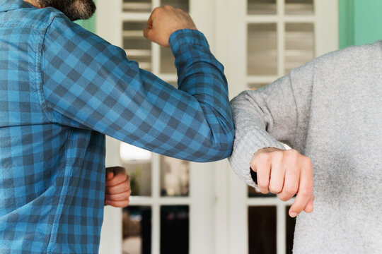 Bumping elbows instead of shaking hands