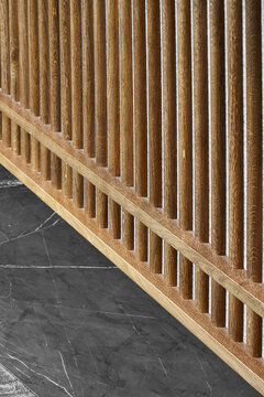 Wooden fence on marble floor