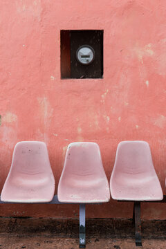 Three empty seats on a bus stop in Mexico