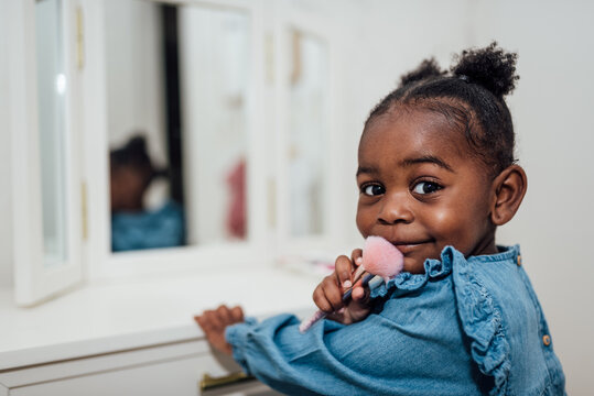 Little Girl Playing with makeup