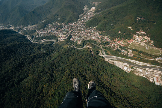 Man Flying On Paraglide in the mountains