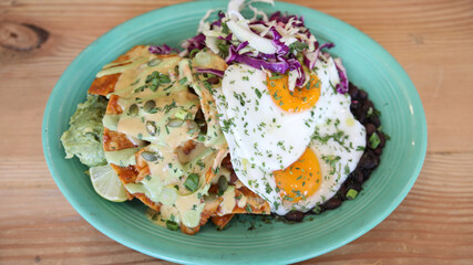 Chilaquiles plate with two eggs 