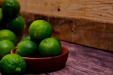 Fresh organic Lime in a wooden Bowl