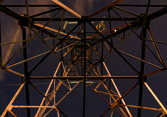 Starry night sky above the power transmission line