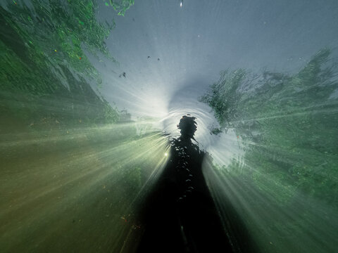 Selfie Silhouette Of a freediver with a blue sunset glow