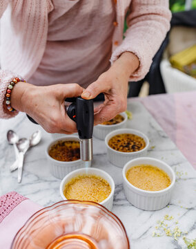 Creme Br√ªl√©e being torched to form a sugar crust