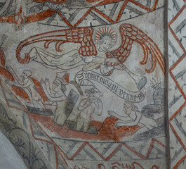 an angel playing the trumpet and the dead rise from the graves