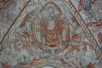 Christ sitting on his throne on judgment day with a lily and a sword from his mouth