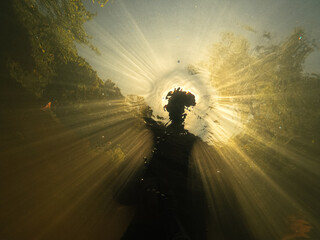 Selfie Silhouette Of a freediver with a golden sunset glow
