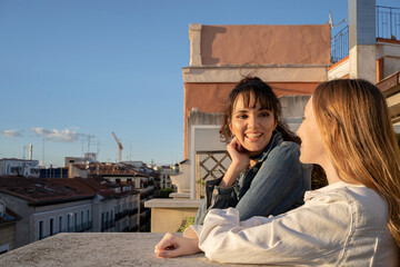 Two Girlfriends Looking At Each Other.
