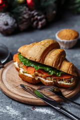 New Year's breakfast with croissants. New Year's croissant with red fish and avocado. New Year and Christmas concept