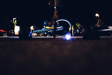 Police conducting the instruction of a crowded for a traffic accident, measuring the stopping distance with an odometer