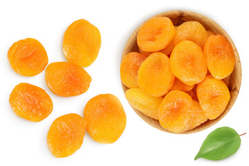 Dried apricots in wooden bowl isolated on white background . Top view. Flat lay
