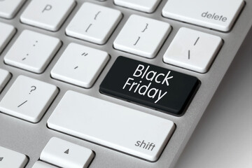 Online shopping. Keyboard with black symbol key - Black Friday. E-commerce concept. Computer, laptop. Shop online from home, lockdown. Buy now. Christmas shopping, sales, discounts.