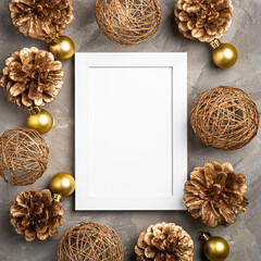 Christmas composition with empty picture frame. Golden ornament, pine cones decorations. Mock up...