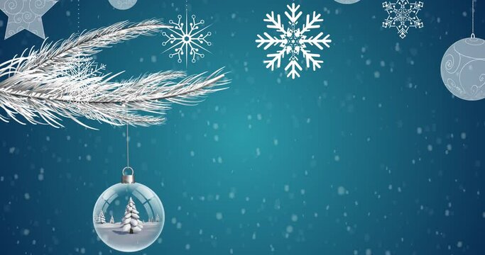 Digital animation of snow falling over christmas decorations hanging against blue background