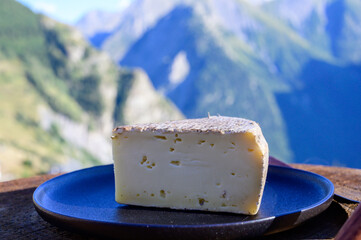 Cheese collection, French tomme de savoie or tome des bauges cheese served outdoor with Alpine...