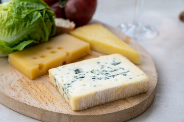 Cheese collection, French fol epi  cheese with many little holes, etorki, tomme noire des pyrenees and ossau iraty cheese