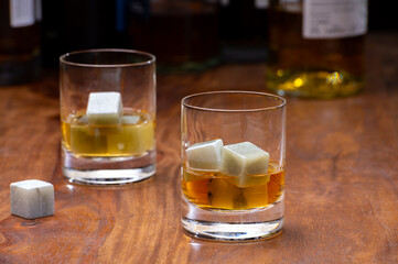 Tasting glass with strong alcoholic spirit drink whisky, cognac, armagnac or calvados
