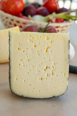 Cheese collection, French fol epi  cheese with many little holes, etorki, tomme noire des pyrenees and ossau iraty cheese