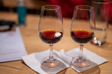 Professional tasting of different fortified dessert ruby, tawny port wines in glasses in porto cellars in Vila Nova de Gaia, Portugal