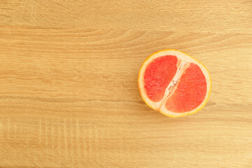 juicy appetizing grapefruits on wooden background