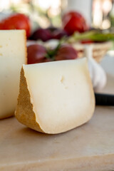 Cheese collection, French fol epi  cheese with many little holes, etorki, tomme noire des pyrenees and ossau iraty cheese