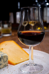 Tasting and pairing of different cheeses with strong alcoholic drinks, whisky, cognac or calvados