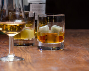 Tasting glass with strong alcoholic spirit drink whisky, cognac, armagnac or calvados