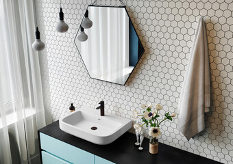Interior of a modern bathroom with a hexagonal mirror and mosaic walls. 3d rendering