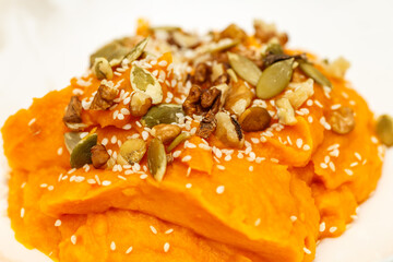 Tasty breakfast. Pumpkin porridge with nuts and honey.