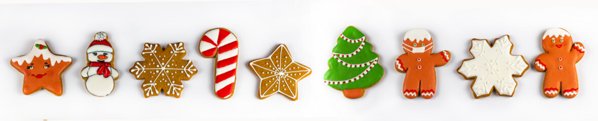 Christmas gingerbread. Delicious homemade gingerbread. Christmas homemade gingerbread. Gingerbread cookies on white on an isolated background. Banner. Screensaver