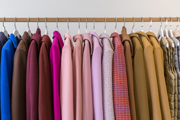 Clothes on hangers, women's multicolored coats