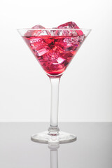 Red martini with ice cubes shot in studio