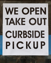 Sign for take out and curbside pickup in black and white.