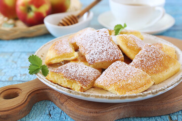 Kaiserschmarrn. Sweet torn pancake (or omelet)  with honey and cup of tea