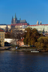 Obraz na płótnie Canvas Autumn colorful Prague Lesser Town with gothic Castle above River Vltava in the sunny Day, Czech Republic