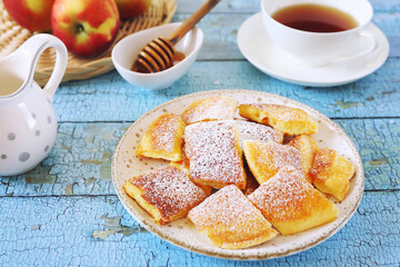 Kaiserschmarrn. Sweet torn pancake (or omelet) with honey and cup of tea