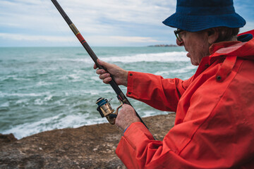Senior man fishing in the sea.