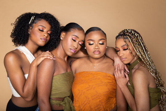 Studio portrait of four beautiful black female friends