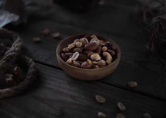 Assorted nuts in a wooden plate