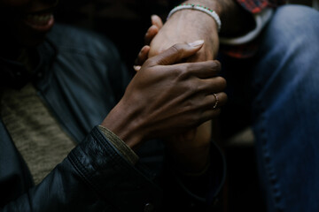 Man and wife holding hands and cherishing their partner