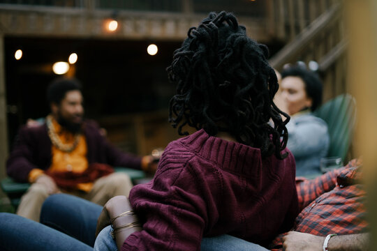 Black friends safely gathered and enjoying a backyard kickback party