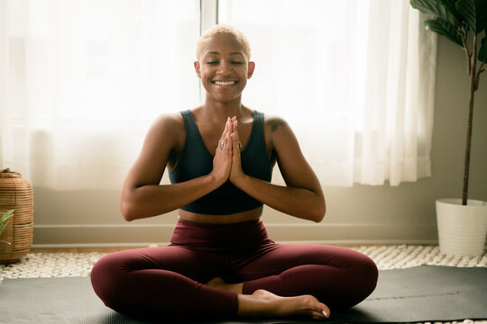 Black Woman Meditating At Home